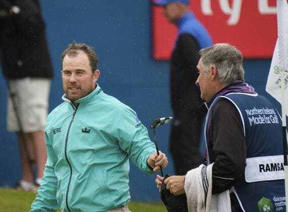 July 9th 2017, Portstewart Golf Club, Portstewart, Northern Ireland; Dubai Duty Free Irish Open Golf Championship, Day 4; Richie Ramsey (SCO) hands his club to his caddy after the finish of his round on the final day xNigelxCookex  ActionPlus11899673