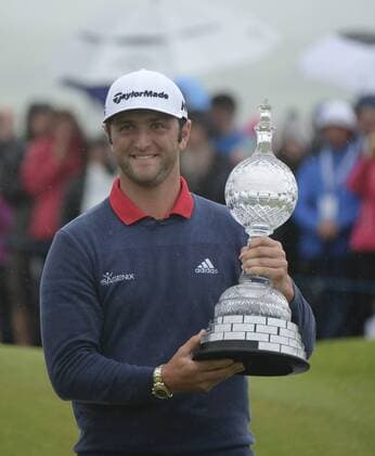 July 9th 2017, Portstewart Golf Club, Portstewart, Northern Ireland; Dubai Duty Free Irish Open Golf Championship, Day 4; Jon Rahm (ESP) celebrates with the trophy on the 18th green after winning the tournament with a score of 24 under par xNigelxCookex  ActionPlus11899697