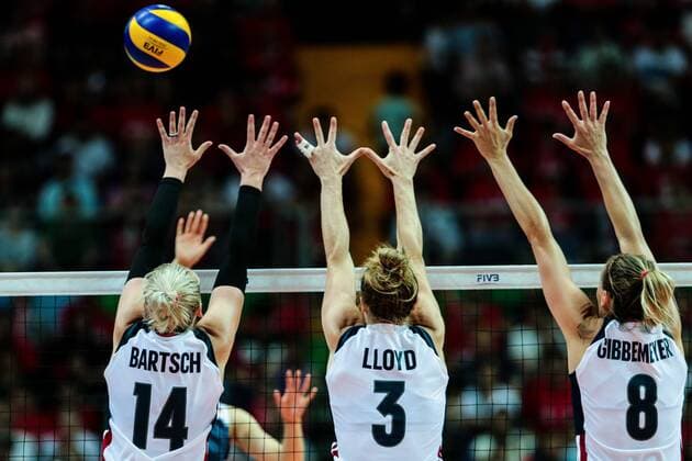 Michelle Bartsch-Hackley, Carli Lloyd and Lauren Gibbemeyer of the United States try to block a spike against China during the Pool B1-Group 1 match of the FIVB World Grand Prix 2017 in Kunshan city, east China s Jiangsu province, 9 July 2017. USA defeated China 3-0 after the Pool B1-Group 1 match of the FIVB World Grand Prix 2017 in Kunshan city, east China s Jiangsu province, 9 July 2017. China beats Russia 3-2 at 2017 FIVB World Grand Prix  20170709_30407