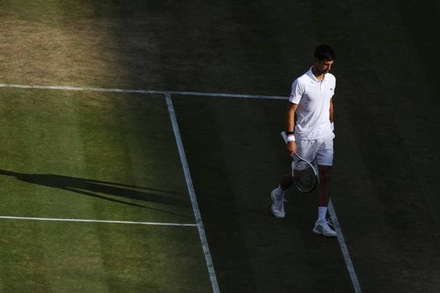 (170713) -- LONDON, July 13, 2017 -- Novak Djokovic of Serbia reacts during the men s singles quarterfinal with Tomas Berdych of Czech Republic during Day 9 of the Wimbledon Championship 2017 in London, Britain on July 12, 2017. Novak Djokovic retired in the second set due to injury. )(wll) (SP)BRITAIN-LONDON-TENNIS-WIMBLEDON-DAY 9 JinxYu 