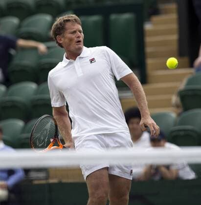 July 13th 2017, All England Lawn Tennis and Croquet Club, London, England; The Wimbledon Tennis Championships, Day 10; Wayne Ferreira (RSA) hits a forehand return during his match with Goran Ivanisevic (CRO) against Jeremy Bates (GBR) and Chris Wilkinson (GBR) xRolandxHarrisonx  ActionPlus11900778