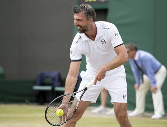 July 13th 2017, All England Lawn Tennis and Croquet Club, London, England; The Wimbledon Tennis Championships, Day 10; Goran Ivanisevic (CRO) serving during his match with Wayne Ferreira (RSA) against Jeremy Bates (GBR) and Chris Wilkinson (GBR) xRolandxHarrisonx  ActionPlus11900792