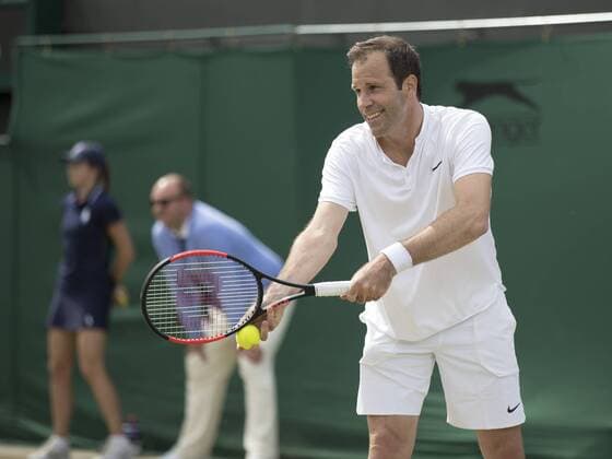 July 13th 2017, All England Lawn Tennis and Croquet Club, London, England; The Wimbledon Tennis Championships, Day 10; Greg Rusedski (GBR) serving during his match with Fabrice Santoro (FRA) against Monsour Bahrami (IRI) and Michael Llordra (FRA) xRolandxHarrisonx  ActionPlus11900829