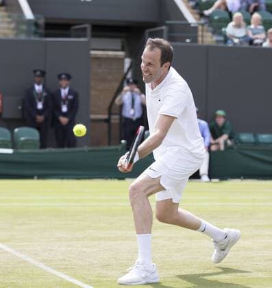 July 13th 2017, All England Lawn Tennis and Croquet Club, London, England; The Wimbledon Tennis Championships, Day 10; Greg Rusedski (GBR) hits a forehand volley return during his match with Fabrice Santoro (FRA) against Monsour Bahrami (IRI) and Michael Llordra (FRA) xRolandxHarrisonx  ActionPlus11900830
