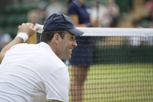 July 13th 2017, All England Lawn Tennis and Croquet Club, London, England; The Wimbledon Tennis Championships, Day 10; Greg Rusedski (GBR) wearing a Ball Boy cap and acting as a Ball Boy during his match with Fabrice Santoro (FRA) against Monsour Bahrami (IRI) and Michael Llordra (FRA) xRolandxHarrisonx  ActionPlus11900831