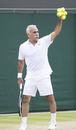 July 13th 2017, All England Lawn Tennis and Croquet Club, London, England; The Wimbledon Tennis Championships, Day 10; Monsour Bahrami (IRI) holds up six tennis balls before he serves during his match with Michael Llordra (FRA) against Greg Rusedski (GBR) and Fabrice Santoro (FRA) xRolandxHarrisonx  ActionPlus11900833