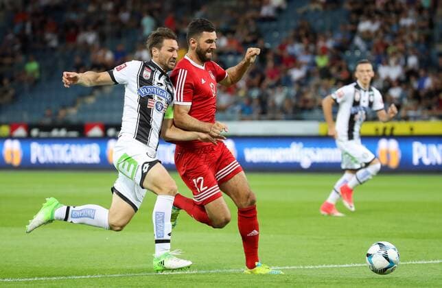 SOCCER - UEFA EL quali, Sturm vs Podgorica GRAZ,AUSTRIA,13.JUL.17 - SOCCER - UEFA Europa League qualification, SK Sturm Graz vs FK Mladost Podgorica. Image shows Christian Schulz (Sturm) and Ivan Knezevic (Podgorica). GEPAxpictures xChristianxWalgram