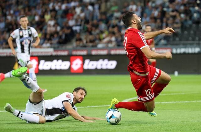 SOCCER - UEFA EL quali, Sturm vs Podgorica GRAZ,AUSTRIA,13.JUL.17 - SOCCER - UEFA Europa League qualification, SK Sturm Graz vs FK Mladost Podgorica. Image shows Christian Schulz (Sturm) and Ivan Knezevic (Podgorica). GEPAxpictures xChristianxWalgram