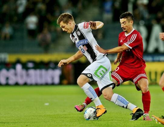SOCCER - UEFA EL quali, Sturm vs Podgorica GRAZ,AUSTRIA,13.JUL.17 - SOCCER - UEFA Europa League qualification, SK Sturm Graz vs FK Mladost Podgorica. Image shows Deni Alar (Sturm) and Marko Cetkovic (Podgorica). GEPAxpictures xM.xOberlaender