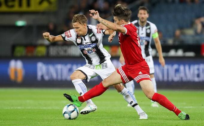 SOCCER - UEFA EL quali, Sturm vs Podgorica GRAZ,AUSTRIA,13.JUL.17 - SOCCER - UEFA Europa League qualification, SK Sturm Graz vs FK Mladost Podgorica. Image shows Stefan Hierlaender (Sturm) and Andrija Kaludjerovic (Podgorica). GEPAxpictures xChristianxWalgram