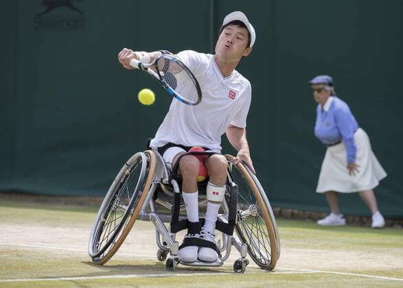 July 14th 2017, All England Lawn Tennis and Croquet Club, London, England; The Wimbledon Tennis Championships, Day 11; Shingo Kunieda (JPN) hits a backhand return to Stefan Olsson (SWE) during their match xRolandxHarrisonx  ActionPlus11901163