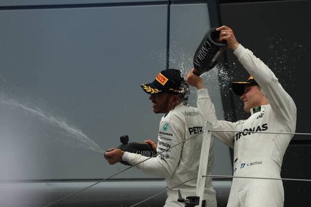 July 16th 2017, Silverstone, Northamptonshire, England; British Formula 1 Grand Prix, Race Day; Lewis Hamilton - Mercedes AMG Petronas F1 W08 EQ Energy+ wins the British GP and gets a champagne shower by team mate Valtteri Bottas xOctanex  ActionPlus11902503