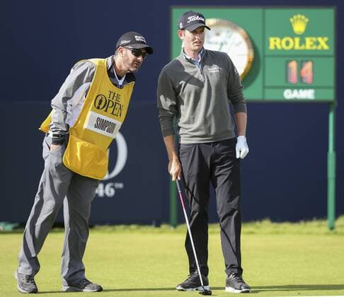 20th July 2017, Royal Birkdale Golf Club, Southport, England; The 146th Open Golf Championship ; First round ; Webb Simpson (USA) discusses the line of his tee shot on the opening hole with his caddie xDavidxBlunsdenx  ActionPlus11903874