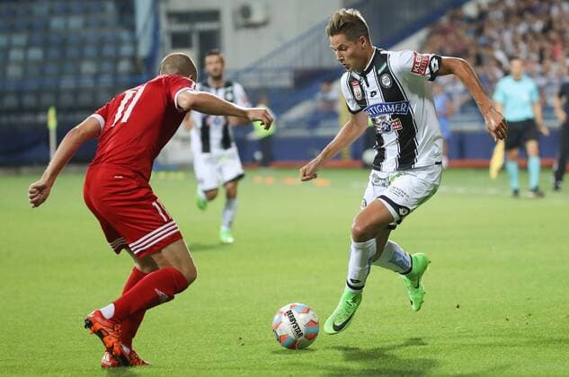 SOCCER - UEFA EL quali, Podgorica vs Sturm PODGORICA,MONTENEGRO,20.JUL.17 - SOCCER - UEFA Europa League qualification, FK Mladost Podgorica vs SK Sturm Graz. Image shows Milan Durisic (Podgorica) and Thorsten Roecher (Sturm). GEPAxpictures xChristianxWalgram