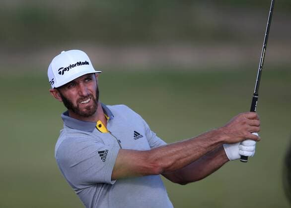 20th July 2017, Royal Birkdale Golf Club, Southport, England; The 146th Open Golf Championship, First round; Dustin Johnson (USA) watches his approach shot on the 16th fairway xDavidxBlunsdenx  ActionPlus11904131