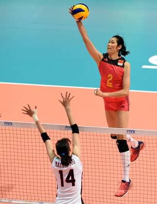 Zhu Ting of China spikes against Ayaka Matsumoto of Japan during the Pool G1-Group 1 match of the FIVB Volleyball World Grand Prix Hong Kong 2017 in Hong Kong, China, 21 July 2017. China defeated Japan 3-1 (25-19, 25-20, 33-35, 25-21). China defeats Japan during FIVB Volleyball World Grand Prix Hong Kong 2017  pbu656153_11
