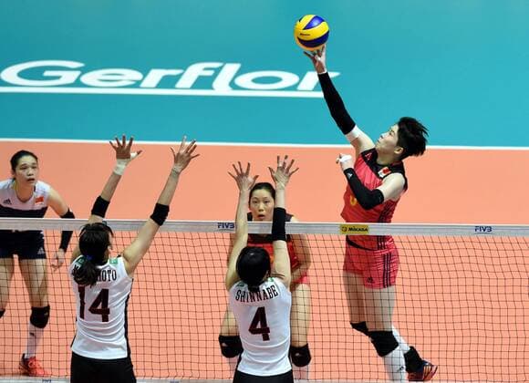 Li Jing, right, of China spikes against Ayaka Matsumoto, and Risa Shinnabe of Japan during the Pool G1-Group 1 match of the FIVB Volleyball World Grand Prix Hong Kong 2017 in Hong Kong, China, 21 July 2017. China defeated Japan 3-1 (25-19, 25-20, 33-35, 25-21). China defeats Japan during FIVB Volleyball World Grand Prix Hong Kong 2017  pbu656153_13