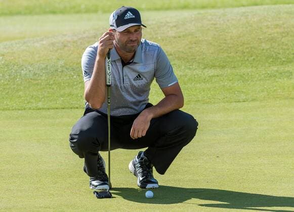 22nd July 2017, Royal Birkdale Golf Club, Southport, England; The 146th Open Golf Championship, third round ; Sergio Garcia (ESP) crouches to line up his putt on the 18th green xDavidxBlunsdenx  ActionPlus11905239