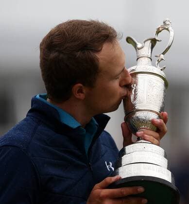 23rd July 2017, Royal Birkdale Golf Club, Southport, England; The 146th Open Golf Championship, fourth round ; Jordan Spieth (USA) kisses the claret jug Open Championship trophy on the 18th green xDavidxBlunsdenx  ActionPlus11905759