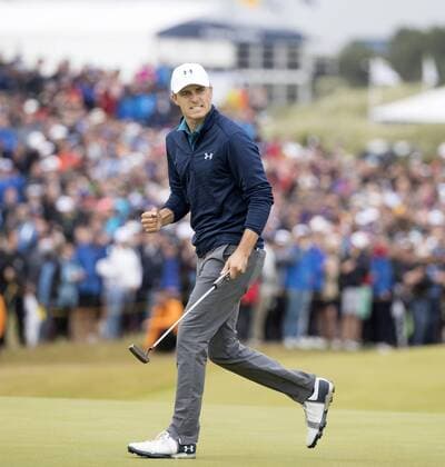 American Jordan Spieth celebrates a birdie on the 16th hole at the 146th Open Championship at Royal Birkdale Golf Club, Southport on July 23, 2017.Spieth beat fellow American Matt Kuchar to win in a combined score of 268, twelve under par.  LON2017072312 HUGOxPHILPOTT