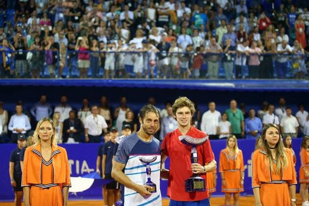 (170724) -- UMAG, July 24, 2017 -- Andrey Rublev of Russia (R) poses with Paolo Lorenzi of Italy during the awarding ceremony for the men s singles final of the ATP Tennis Herren Croatia Open 2017 in Umag, Croatia, on July 23, 2017. Andrey Rublev calimed the title by defeating Paolo Lorenzi with 2-0. ) (SP)CROATIA-UMAG-TENNIS-ATP-CROATIA OPEN SlavkoxMidzor 
