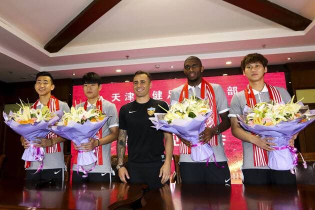 Italian head coach Fabio Cannavaro of Tianjin Quanjian Football Club, center, French football star Anthony Modeste, second right, and other new teammates attend a press conference PK Pressekonferenz in Tianjin, China, 17 July 2017. Anthony Modeste  20170717_31043