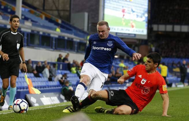 Wayne Rooney of Everton tackled by Kristi Qose of MFK Ruzomberok during the Europa League Qualifying Third Round 1st leg match at Goodison Park Stadium, Liverpool. Picture date: March 27th 2017. Pic credit should read: Simon Bellis Sportimage EDITORIAL USE ONLY. No use with unauthorised audio, video, data, fixture lists, club league logos or live services. Online in-match use limited to 120 images, no video emulation. No use in betting, games or single club league player publications.