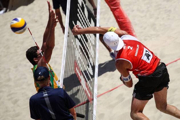 Beach volleyball Beachvolleyball - FIVB World Championships 2017 VIENNA,AUSTRIA,31.JUL.17 - BEACH VOLLEYBALL - FIVB World Championships, men. Image shows Christoph Dressler (AUT) and Saymon Barbosa Santos (BRA). GEPAxpictures xMaticxKlansek