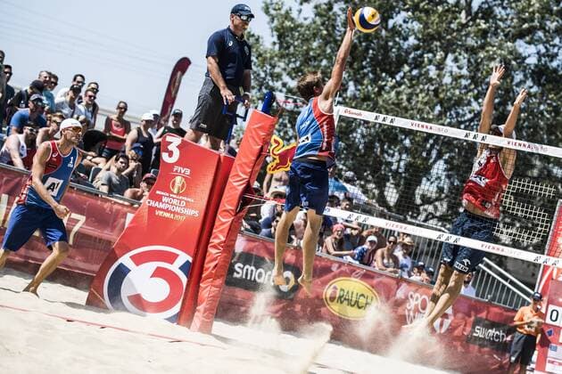 VIENNA, AUSTRIA - AUGUST 01: Taylor Crabb of the United States spikes the ball during Day 5 of the FIVB Beach volleyball Beachvolleyball World Championships 2017 on August 1, 2017 in Vienna, Austria. (Photo by Malte Christians Hoch Zwei) Vienna Austria xHOCHxZWEIx