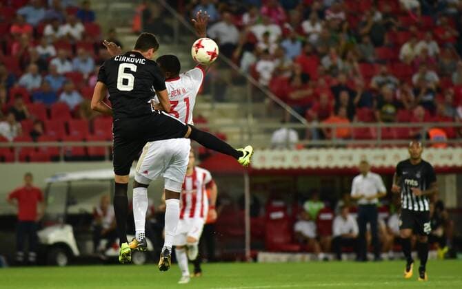 Greece: Olympiacos vs Partizan El Fardou Ben Nabouhane (no 31) of Olympiacos and Lazar Cirkovic (no 6) of Partizan vindicate the ball during the game.  DimitriosxKarvountzis PacificxPress
