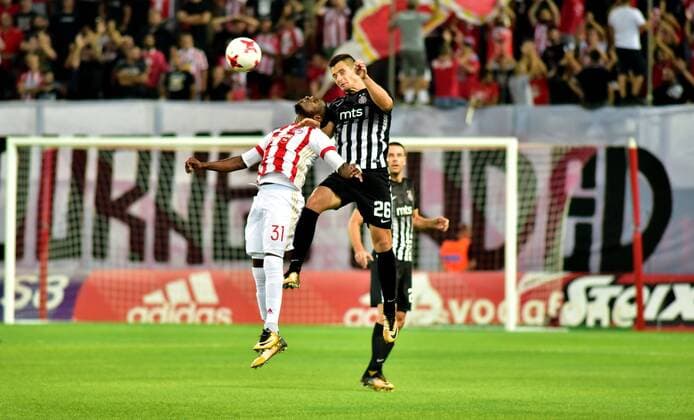 Greece: Olympiacos vs Partizan El Fardou Ben Nabouhane (no 31) of Olympiacos and Nemanja Miletic (no 26) of Partizan vindicate the ball during the game.  DimitriosxKarvountzis PacificxPress