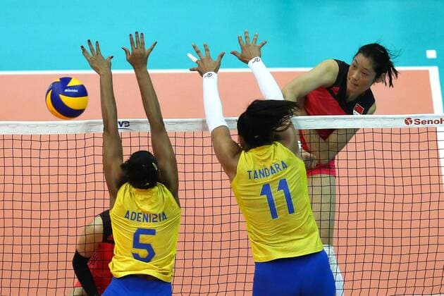 Zhu Ting of China, back right, spikes against Brazil during their match of the FIVB Volleyball World Grand Prix Finals 2017 in Nanjing city, east China s Jiangsu province, 2 August 2017. China defeated Brazil 3-0 (25:22, 25:17, 29:27). China slashes Brazil 3-0 at FIVB Volleyball World Grand Prix Finals 2017  20170802_09163