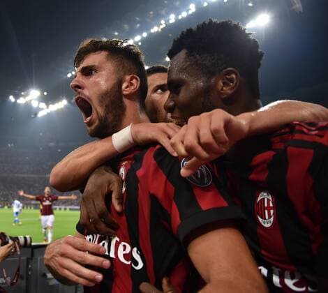 (170804) -- MILAN, Aug. 4, 2017 -- AC Milan s Patrik Cutrone (L) celebrates after scoring during the Europa League third qualifying round second leg soccer match against U Craiova at the San Siro Stadium in Milan, Italy, Aug. 3, 2017. AC Milan won 2-0. ) (SP)ITALY-MILAN-SOCCER-EUROPA LEAGUE-AC MILAN-CRAIOVA AlbertoxLingria 