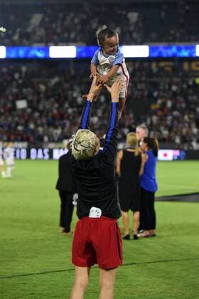 CARSON, CA - AUGUST 03: Megan Rapinoe (15) of USA plays with Cassius the son of team mate Sydney Leroux (2) of USA during the Tournament of Nations soccer match between USA and Japan on August 03, 2017 at StubHub Center in Carson, CA. USA defeated Japan 3-0, and Australia won the tournament. (Photo by Chris Williams Icon Sportswire) SOCCER: AUG 03 Tournament of Nations - USA v Japan Icon00717080116302 EDITORIAL USE ONLY