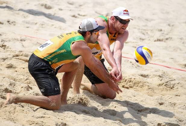 Beach volleyball Beachvolleyball - FIVB World Championships 2017 VIENNA,AUSTRIA,04.AUG.17 - BEACH VOLLEYBALL - FIVB World Championships. Image shows Bruno Oscar Schmidt and Alison Cerutti (BRA). GEPAxpictures xChristianxWalgram