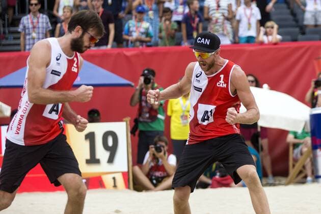 VIENNA, AUSTRIA - AUGUST 05: Ben Saxton and Chaim Schalk of Canada celebrate during Day 9 of the FIVB Beach volleyball Beachvolleyball World Championships 2017 on August 5, 2017 in Vienna, Austria. (Photo by Michael Kunkel Hoch Zwei) Vienna Austria xHOCHxZWEIx