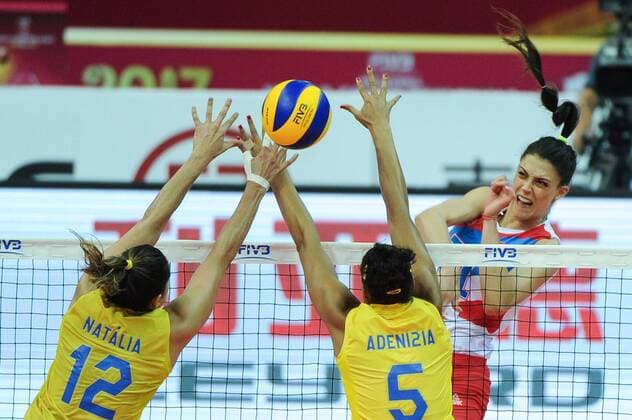 Natalia Pereira, left, and Adenizia Da Silva of Brazil spike against Stefana Veljkovic of Serbia during their match of the FIVB Volleyball World Grand Prix Finals 2017 in Nanjing city, east China s Jiangsu province, 5 August 2017. Brazil defeated Serbia 3-1 (20-25, 25-23, 25-14, 25-23). Brazil eliminates Serbia at FIVB Volleyball World Grand Prix Finals 2017  20170805_60147