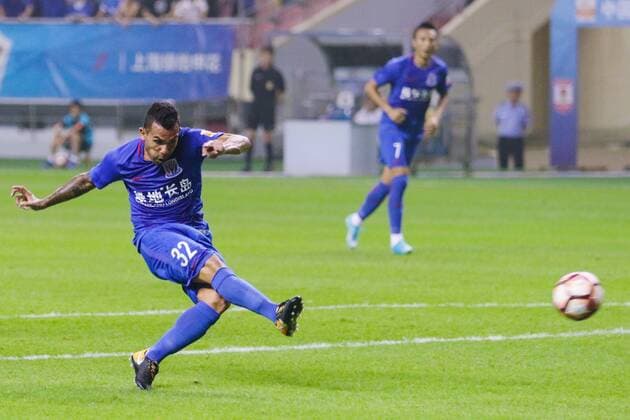 Argentine football player Carlos Tevez of Shanghai Greenland Shenhua kicks the ball to shoot against Changchun Yatai in their 20th round match during the 2017 Chinese Football Association Super League (CSL) in Shanghai, China, 5 August 2017. Shanghai Greenland Shenhua played draw to Changchun Yatai 1-1. Shanghai Greenland Shenhua plays draw to Changchun Yatai at 20th round of 2017 CSL  20170805_49106