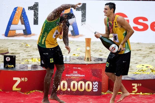 VIENNA, AUSTRIA - AUGUST 06: Evandro Goncalves Oliveira Junior and Andre Loyola Stein of Brazil celebrate after winning the gold medal match during Day 10 of the FIVB Beach volleyball Beachvolleyball World Championships 2017 on August 6, 2017 in Vienna, Austria. (Photo by Michael Kunkel Hoch Zwei) Vienna Austria xHOCHxZWEIx