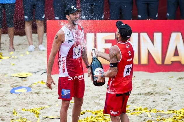 VIENNA, AUSTRIA - AUGUST 06: Clemens Doppler and Alexander Horst of Austria celebrate winning the silver medal during Day 10 of the FIVB Beach volleyball Beachvolleyball World Championships 2017 on August 6, 2017 in Vienna, Austria. (Photo by Michael Kunkel Hoch Zwei) Vienna Austria xHOCHxZWEIx