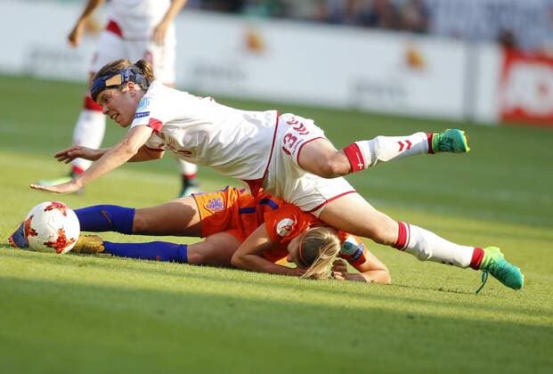 (170807) -- ENSCHEDE, Aug. 7, 2017 -- Kika van Es of the Netherlands and Sanne Troelsgaard (top) of Denmark fall down during the UEFA Women s EURO 2017 soccer tournament final match between Netherlands and Denmark in Enschede, the Netherlands, Aug. 6, 2017. The Netherlands won 4-2 and claimed the title. ) (SP)NETHERLANDS-ENSCHEDE-UEFA-WOMEN S EURO 2017 FINAL-NETHERLANDS VS DENMARK YexPingfan 