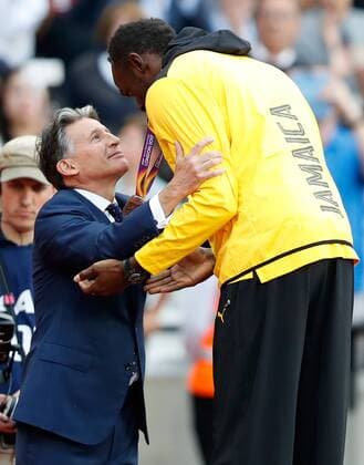 (170807) -- LONDON, Aug. 7, 2017 -- IAAF President Sebastian Coe (L) awards bronze medal to Usain Bolt of Jamaica during the awarding ceremony for Men s 100m Final on Day 3 of the 2017 IAAF World Championships in London, Britain, on Aug. 6, 2017. ) (SP)BRITAIN-LONDON-ATHLETICS-IAAF-WORLD CHAMPIONSHIPS-DAY 3 WangxLili 