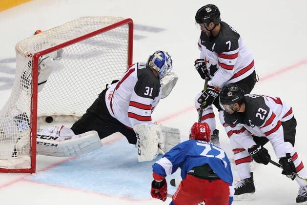 SOCHI, RUSSIA - AUGUST 7, 2017: Canada s goaltender Justin Peters (L) concedes a goal in their Sochi Hockey Open 2017 match against the Russian Olympic team at Sochi s Bolshoi Palace of Sports. Artyom Korotayev TASS  TS05A8EE