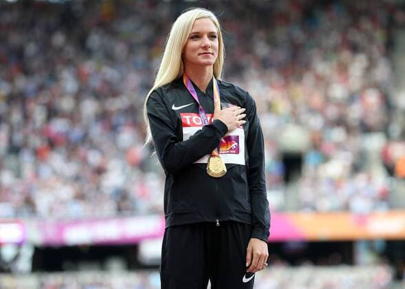 August 12th 2017, London Stadium, East London, England; IAAF World Championships, Day 9; Emma Coburn of the USA stands for the national anthem with the Gold Medal for the 3000 metres Steeplechase during the medal ceremony xJohnxPatrickxFletcherx  ActionPlus11915495