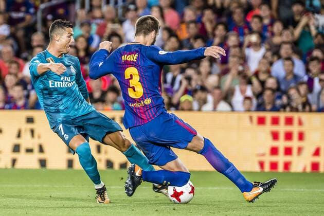 August 13, 2017 - Barcelona, Catalonia, Spain - Real Madrid forward RONALDO competes with FC Barcelona Barca defender PIQUE for the ball during the Spanish Super Cup Final 1st leg between FC Barcelona and Real Madrid at the Camp Nou stadium in Barcelona FC Barcelona 1:3 Real Madrid - Spanish Super Cup 2017 - ZUMAo105 20170813_zap_o105_045 Copyright: xMatthiasxOesterlex