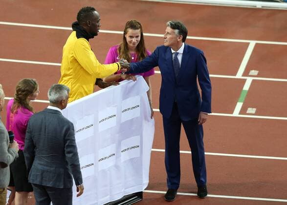 August 13th 2017, London Stadium, East London, England; IAAF World Championships, Day 10; President of the International Association of Athletics Federations Sebastian Coe shakes hands with Usain Bolt of Jamaica during Usain Bolts farewell occasion xJohnxPatrickxFletcherx  ActionPlus11916649