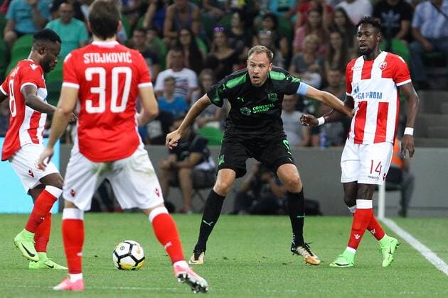 KRASNODAR, RUSSIA - AUGUST 17, 2017: Crvena Zvezda Belgrade s Guelor Kanga, Filip Stojkovic (L-R), Richmond Boakye (R), and FC Krasnodarâ€™s Andreas Granqvist (2nd R) fight for the ball in their 2017 2018 UEFA Europa League Playoff 1st Leg football match at Krasnodar Stadium. Vitaly Timkiv TASS  TS05BC42