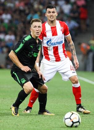 KRASNODAR, RUSSIA - AUGUST 17, 2017: FC Krasnodarâ€™s Sergei Petrov (L) and Crvena Zvezda Belgrade s Nemanja Radonjic in their 2017 2018 UEFA Europa League Playoff 1st Leg football match at Krasnodar Stadium. Vitaly Timkiv TASS  TS05BC58