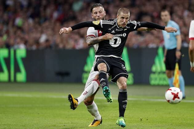 AMSTERDAM, Stadion Arena , 17-08-2017 . Voorronde Europa League seizoen 2017 2018 . Ajax - Rosenborg BK . Mitchell Dijks in duel met Rosenborg-speler Milan Jevtovic Ajax - Rosenborg  x1673540x