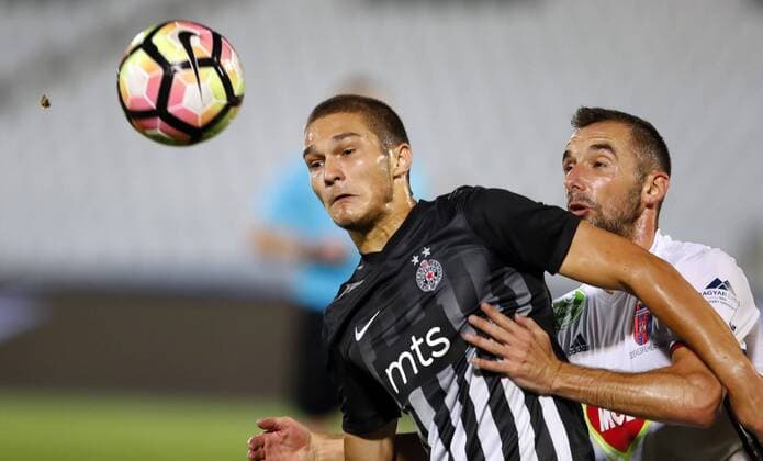 (170818) -- BELGRADE, Aug. 18, 2017 -- Partizan s Djordje Jovanovic (L) vies with Videoton s Attila Fiola during the UEFA Europa League play-offs first leg football match between Partizan and Videoton in Belgrade, Serbia, on Aug. 17, 2017. The match ended 0-0 tie. ) (SP)SERBIA-BELGRADE-SOCCER-UEFA-PARTIZAN VS VIDEOTON PredragxMilosavljevic 